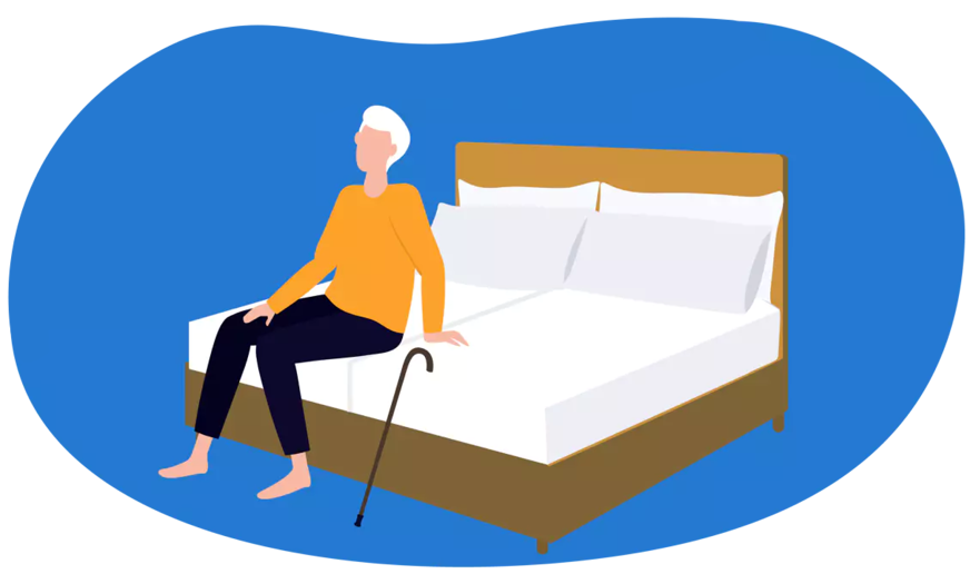 Senior sitzt auf dem Bett
